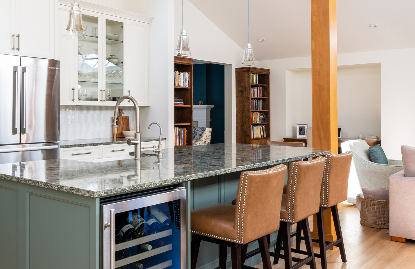 Modern kitchen renovation with white cabinets and island