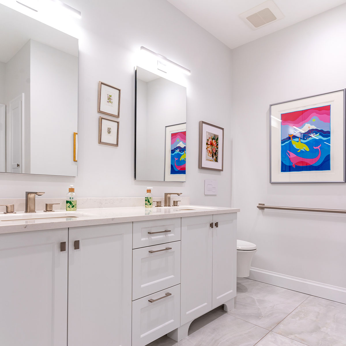 Colorful painting in a bathroom with a large mirror, creating a vibrant space.