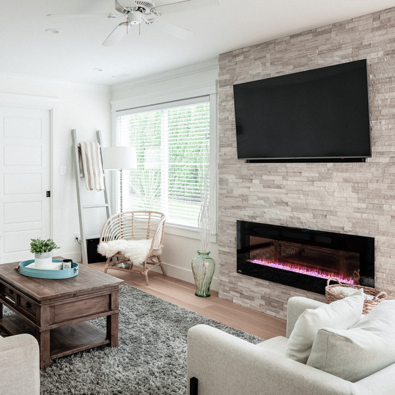 Spaces18-home-renovation-langley-3 Cozy living room with fireplace and TV.