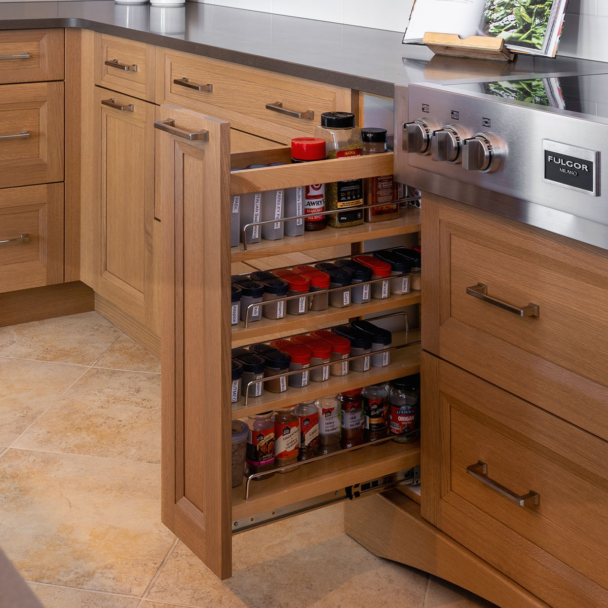 A kitchen with a pull out spice rack: a convenient storage solution for spices and seasonings.