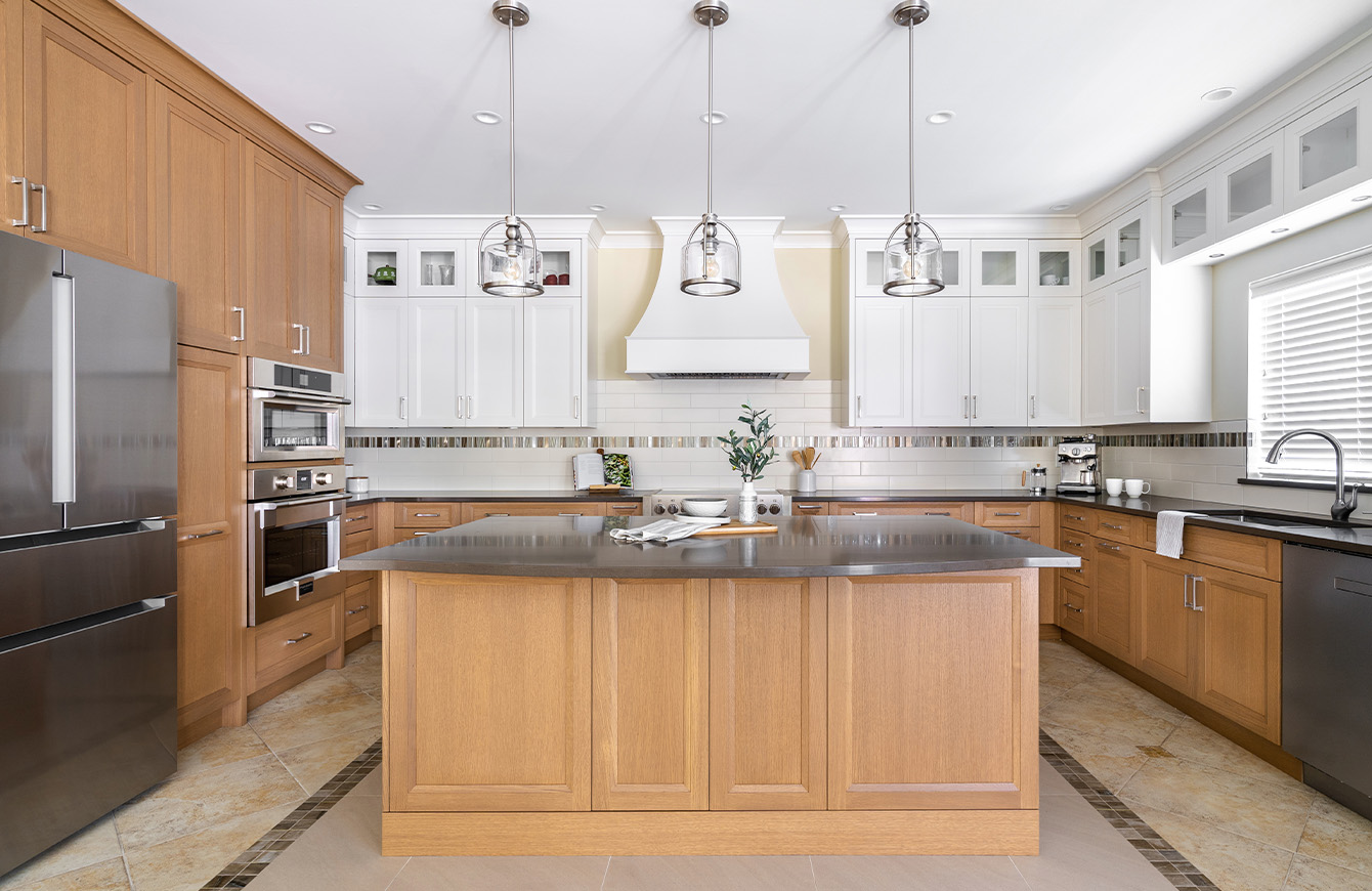 Modern kitchen with center island and stainless steel appliances.